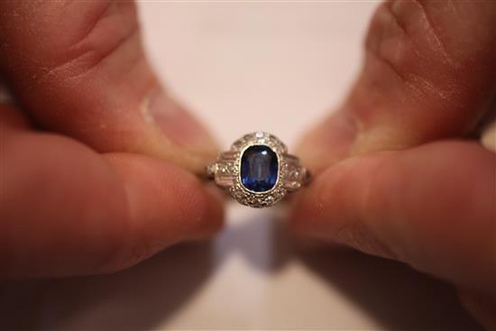 A 1930s Art Deco 18ct white gold and platinum, sapphire and diamond cluster ring, size K.